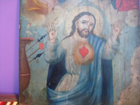 Mexican vintage devotional art, a beautiful retablo painted on tin depicting the Sacred Heart of Jesus, the power of God, Mexico, c. 1920.  Closeup photo of the figure of the Sacred Heart.